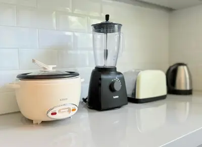 a blender sitting on top of a kitchen counter at Umalas cozy 3 Bedrooms private pool villa in Kerobokan