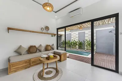 a living room with a couch and a table at Nara V3 2BR Escape in the Heart of Seminyak in Seminyak