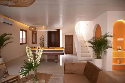 a living room with a piano and a stairway at Luxury 3BR Canggu | Billiards | Outdoor Cinema in Canggu