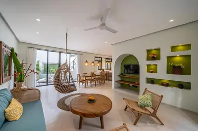 a living room with a table and chairs at Tropical 3BR Oasis w Private Pool Villa Nau Mai in Seminyak