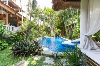 a swimming pool in the yard of a house at Charming, Homely, Pool, Lush Gardens, Umalas, Cozy in Kerobokan