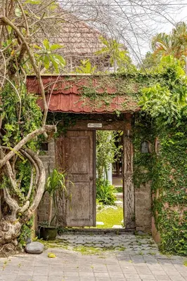 an entrance to an old building with a door at Charming, Homely, Pool, Lush Gardens, Umalas, Cozy in Kerobokan