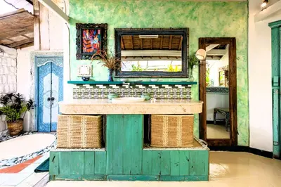 a bathroom with a green sink and a mirror at Charming, Homely, Pool, Lush Gardens, Umalas, Cozy in Kerobokan