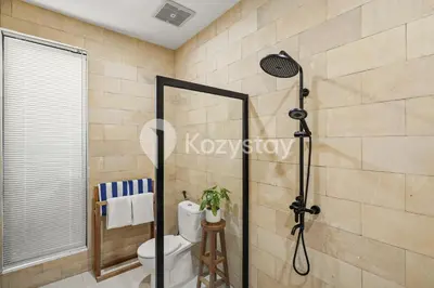 a shower stall in a bathroom with a toilet at Sadin Villa by Kozystay - Umalas in Kerobokan