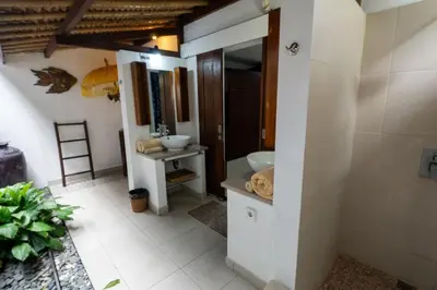 a bathroom with a sink and a mirror at Kangin villa 2 bedrooms in the heart of Seminyak in Kuta