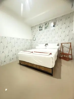 a white bedroom with two beds in a room at Private Room In Bali 10Mints To Sanur Beach in Sanur