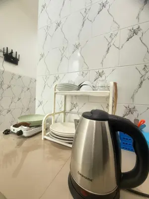 a tea kettle sitting on a counter in a kitchen at Private Room In Bali 10Mints To Sanur Beach in Sanur