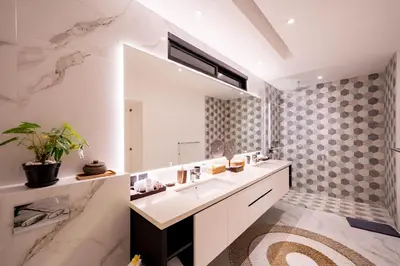 a bathroom with a sink and a mirror at Villa Samyati Kerobokan in Seminyak