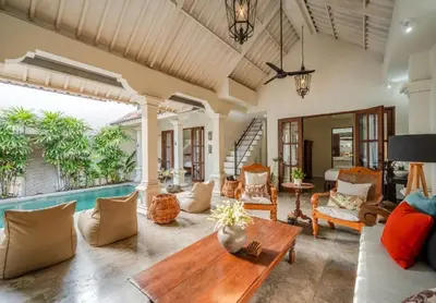 a living room with a couch and a table at Seminyak Pool Villa in Seminyak