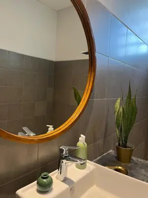 a bathroom with a sink and a mirror at Casa Oliva - Tropical Pool Villa on Trendy Seminyak Eat Street in Seminyak