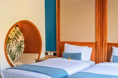 two beds sitting next to each other in a room at Malayna Comfortable 2 BR Royal Private Pool Villa in Seminyak