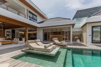 a living room with a pool and a house at Villa Selena Space Luxury 4BR 15m Pool BBQ Staffed in Seminyak