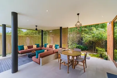a living room with a couch and a table at Luxury Rosa Village - 4 Bedrooms Walkable to Beach in Jimbaran