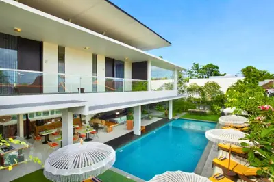 an aerial view of a house with a swimming pool at Varenya Cozy 1 BR Suite Twin Room in Kerobokan