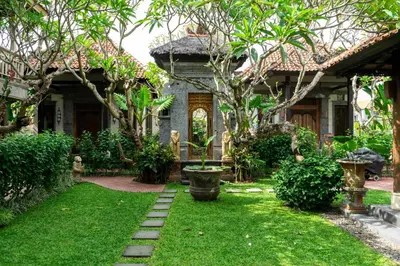 a garden in front of a house at Puri Sekar Bali in Pesanggaran