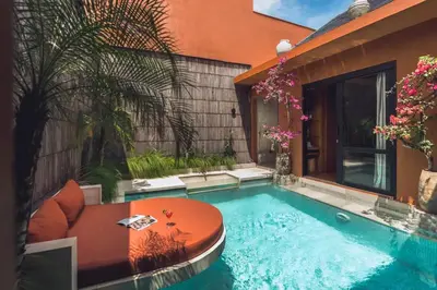 a swimming pool in the backyard of a house at Yaseera Aesthetic 1 BR Grand Smart Private Pool Villa in Seminyak