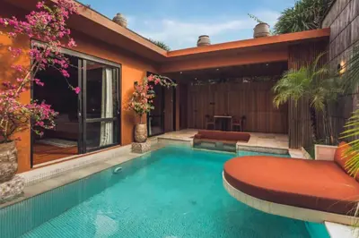 a swimming pool in the backyard of a house at Yaseera Aesthetic 1 BR Grand Smart Private Pool Villa in Seminyak