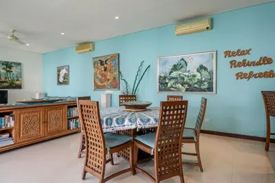 a dining room with a table and chairs at Villa Samsara 3BR Pool Villa Near Berawa Beach in Canggu