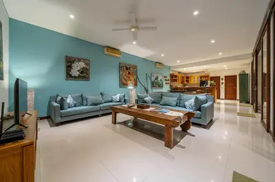 a living room with a couch and a table at Villa Samsara 3BR Pool Villa Near Berawa Beach in Canggu