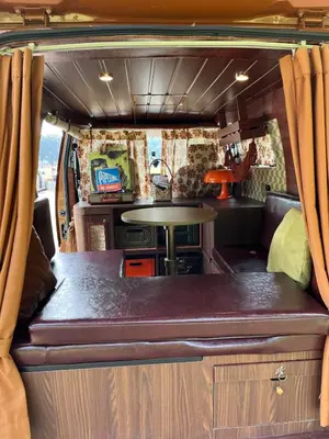 a dining area in an rv with a table at Wandervan - Bali Campervan Rental in Kuta