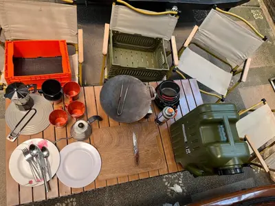 an overhead view of a table with plates and pans at Wandervan - Bali Campervan Rental in Kuta