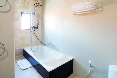 a bathroom with a sink and a bath tub at 6 Bedrooms Pool Twin Villa in West Sanur in Sanur