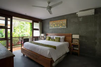 a bedroom with a large bed and a window at Boutique Modern Luxury in the Heart of Seminyak in Seminyak