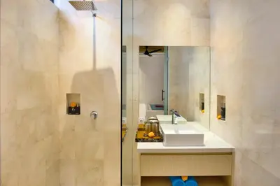 a bathroom with a sink and a mirror at Halina Cozy 2 BR Private Pool Villa With Bathtub in Legian