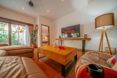 a living room with a couch and a coffee table at Stunning villa in Umalas center in Canggu