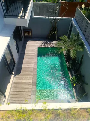 an overhead view of a swimming pool next to a house at Villa Delila in Canguu in Canggu
