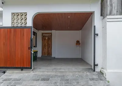 an entrance to a building with a wooden door at Villa Delila in Canguu in Canggu