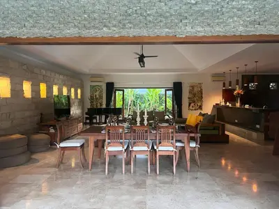 a dining room with a table and chairs at Beachside Luxury Private Villa in Sanur in Sanur