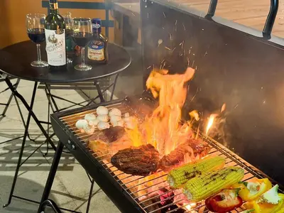 a grill with some meat and vegetables on it at 5beds, 10 ppl, 10mins to beach, Private Pool in Sanur