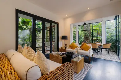 a living room with a couch and a table at Luxury with A Soul - Martini 2 1BR Villa Reimagined in Kerobokan