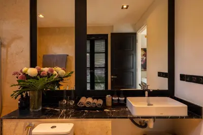 a bathroom with a sink and a mirror at Walk into Serenity, Martini 3 - 1BR Treetop Villa in Kerobokan