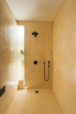 a bathroom with a shower with a hose on the wall at Villa Kina - Tropical 2BR Villa with Pool and Billiard in Seminyak