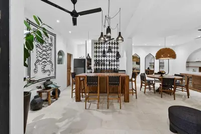 a kitchen and dining room with a table and chairs at Black Diamond - Luxury 3BR Villa in Umalas in Kerobokan