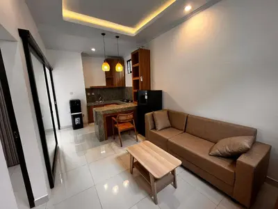 a living room with a couch and a table at BEN & B Villa 2 in Kerobokan