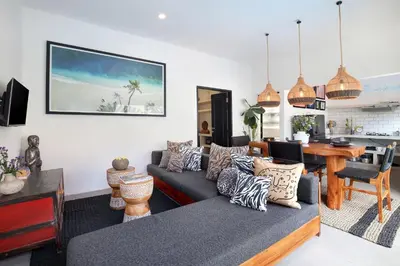a living room with a couch and a table at Villa Suka Saki Seminyak with pool, wifi, & staff in Seminyak