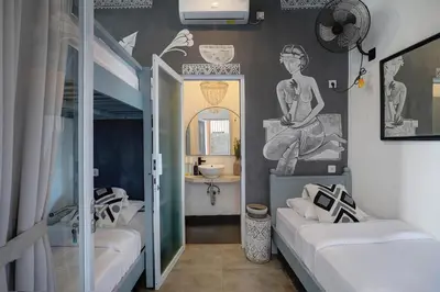 a room with two beds and a bathroom with a mirror at 5 min walk to Seminyak Beach - Architect Designed Luxury Villa - Private Butler & Breakfast in Seminyak