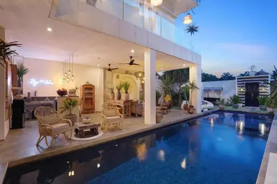 a house with a swimming pool and a living room at 5 min walk to Seminyak Beach - Architect Designed Luxury Villa - Private Butler & Breakfast in Seminyak