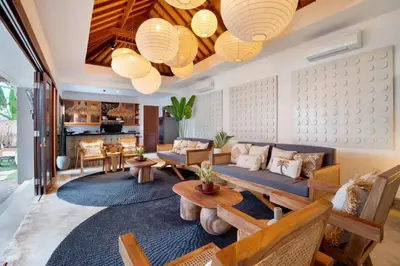 a living room with a couch and a table at 5BR Luxury Berawa Canggu with Butler in Canggu
