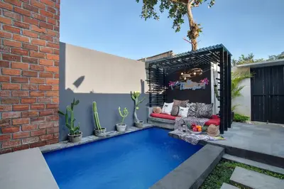 a swimming pool in the backyard of a house at 1BR Villa Private Pool Seminyak Mertanadi in Seminyak