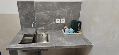 a kitchen counter with a sink and a sink at Jepun segara homestay in Ngurah Rai International Airport