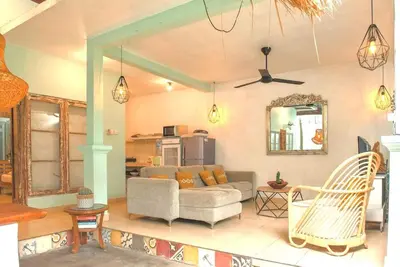a living room with a couch and a table at 2 BR Central Seminyak Villa Hibiscus Walk to shop and Beach in Seminyak