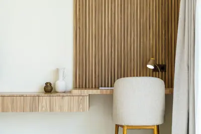 a room with a chair and a shelf and a lamp at Private Romantic Pool 1bd Villa in Seminyak in Seminyak