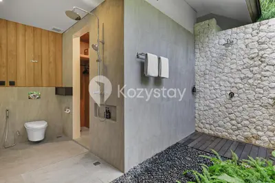 a bathroom with a shower and a toilet at Niskala Villa by Kozystay - Natadesa Resort in Jimbaran