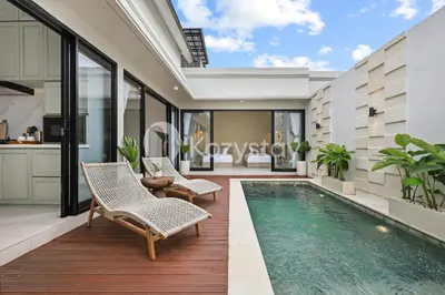 a villa with a swimming pool and a kitchen at Surbiton Villa by Kozystay - Seminyak in Seminyak