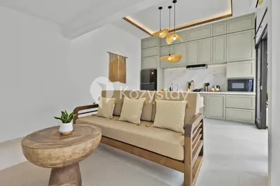 a living room with a couch and a table at Surbiton Villa by Kozystay - Seminyak in Seminyak