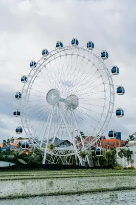 a ferris wheel at a theme park at The Wheel Bali in Canggu